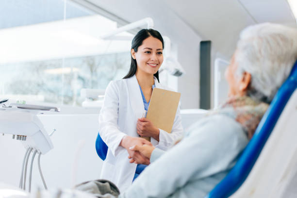 Dentist greets his patient