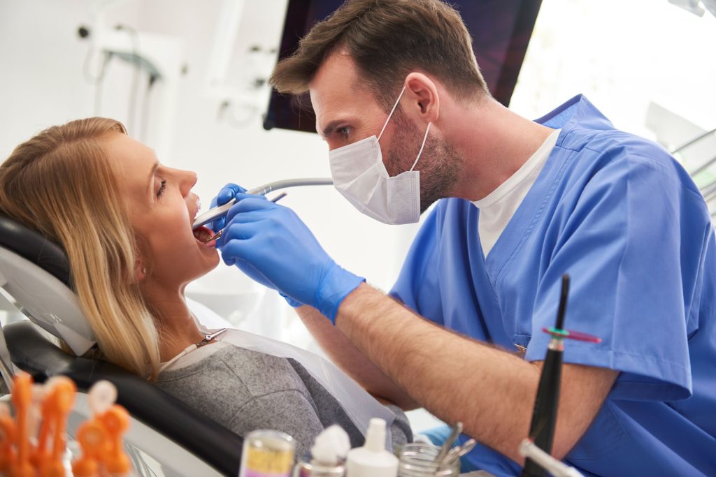 Dentist performing procedure