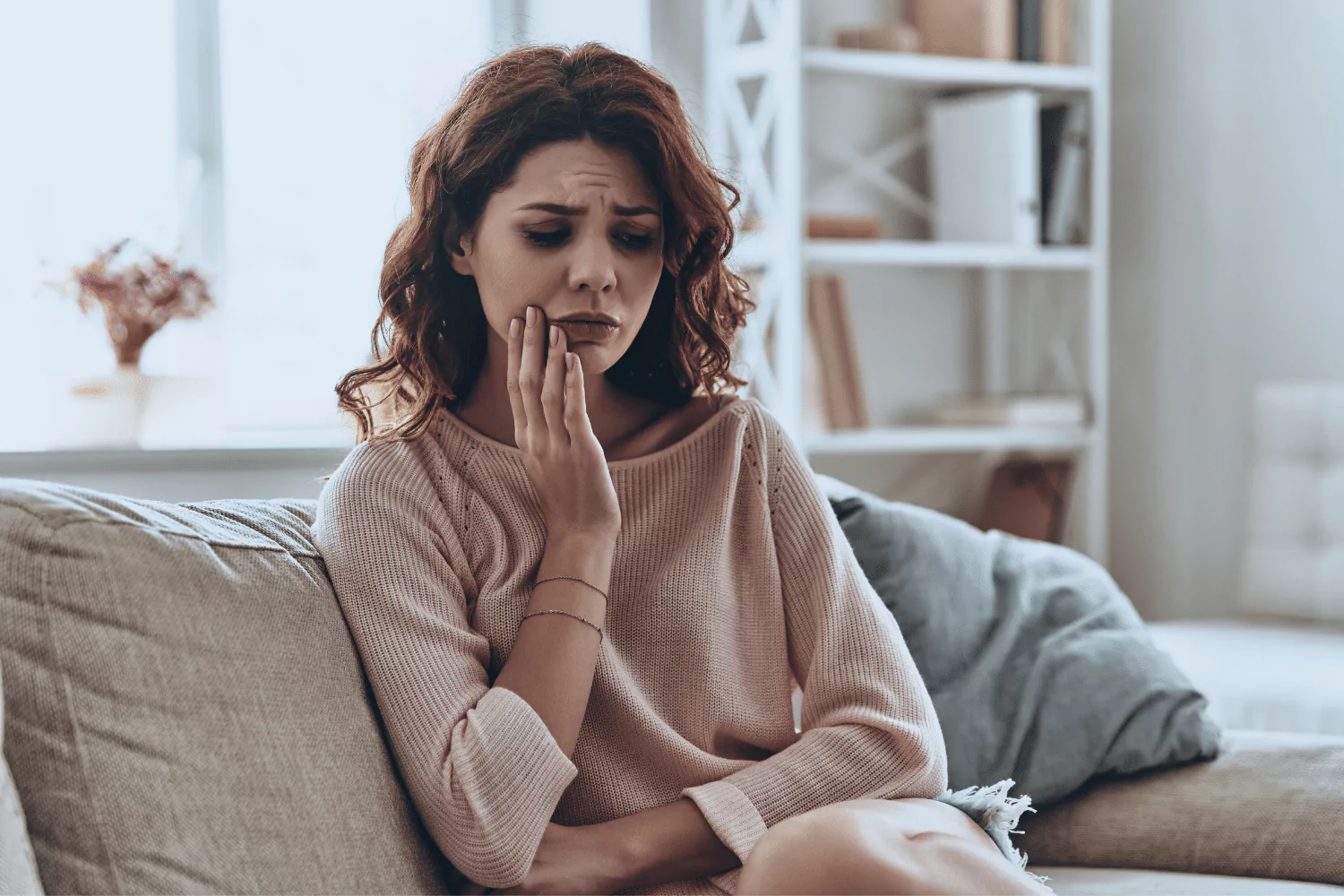 Woman suffering from wisdom tooth pain